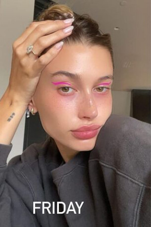 Pink Winged Eyeliner and Grey Sweatshirt