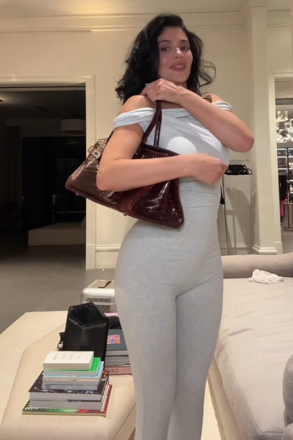 Twisted Off-The-Shoulder Catsuit and Hermes Shoulder Bag